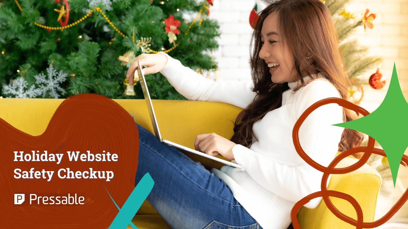 Female wearing white sweater smiling sitting on couch opening laptop with Christmas decoration behind